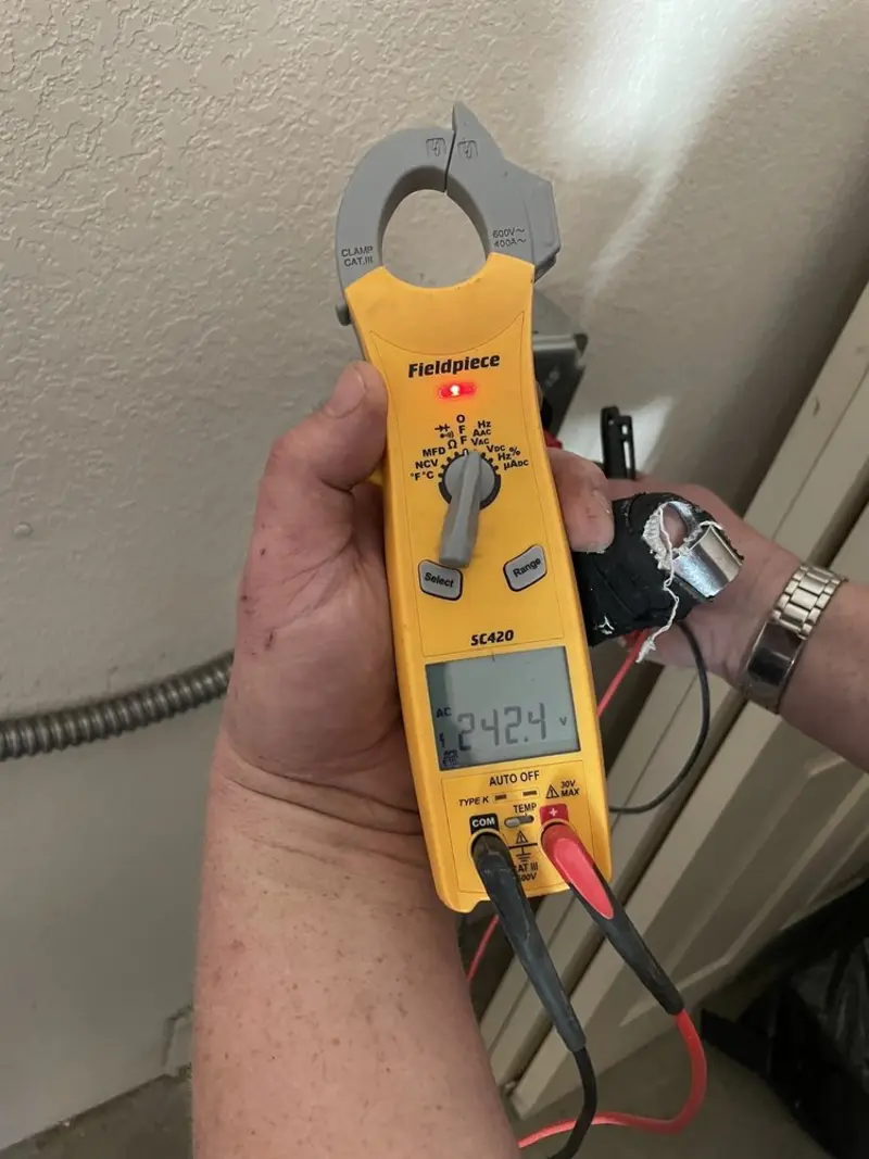 Voltage testing with clamp meter during Electrical Installation Services in Stokesdale